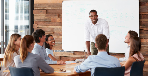 An EdD graduate speaking to a group