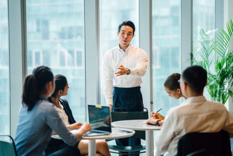 Business leader giving a presentation to his coworkers