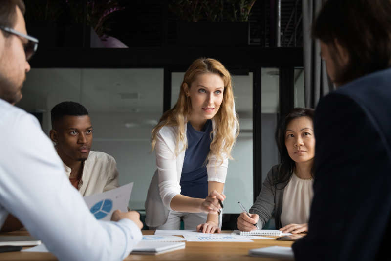 A business leader working with her team on new strategic initiatives
