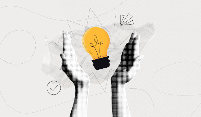 A pair of hands holding a lightbulb, representing innovation