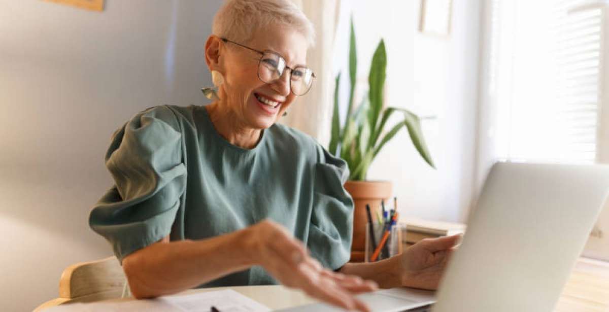 An educational leader communicating with her team online