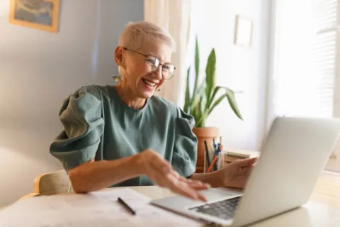An educational leader communicating with her team online