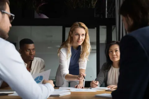 A business leader working with her team on new strategic initiatives