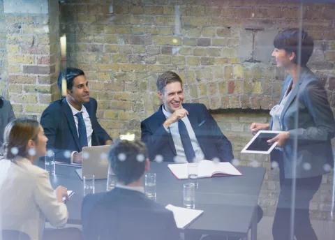 A group of professionals gathered in a conference room.