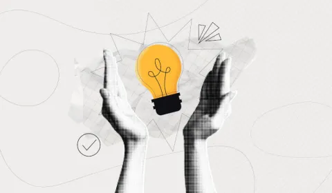 A pair of hands holding a lightbulb, representing innovation